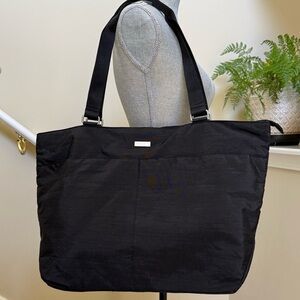 New without tag.  Baggallini Everyday Black Tote Bag. Metal logo tag on front.
